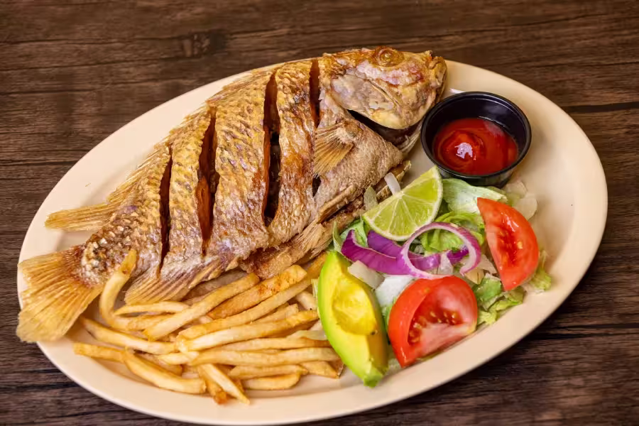 Fried Mojarra with frech fries and salad